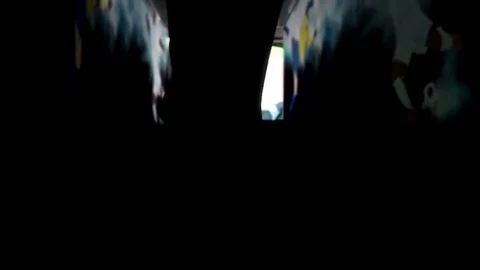 Silhouette of a football player getting out from a tunnel of a stadium Stock Footage