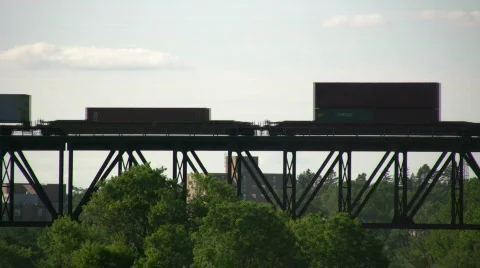 Silhouette of a freight train moving down tracks (High Definition) Stock-Footage 360841
