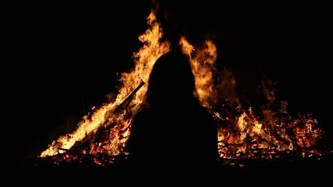 Silhouette in front of fire Stock Footage 122306863