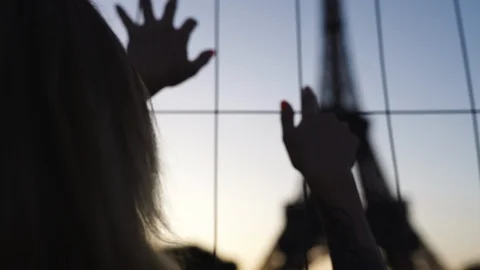 Silhouette of a girl on the background of the Eiffel Tower in Paris Stock Footage 123740787