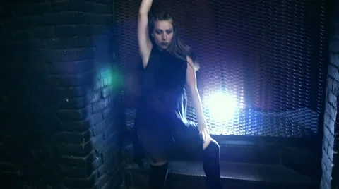 Silhouette of a girl dancing on the background light Stock Footage 65239235
