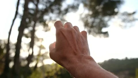 Silhouette of a girl pulls her hand to the sun. Religion helping hand. Stock Footage 238399676