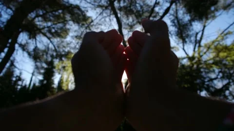 Silhouette of a girl pulls her hand to the sun. Religion helping hand. Stock Footage 238399727