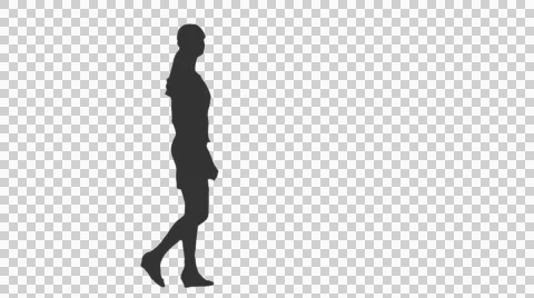 Silhouette of a girl walking around and watching something (on alpha matte) Stock Footage