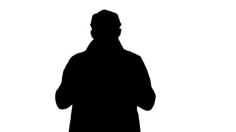 Silhouette Good looking man talking to camera and walking. Think Stock Illustration