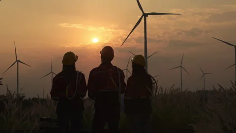 Silhouette of group engineers and windmills on the background Stock Footage 264223965