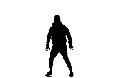 Silhouette of guy dancer dancing hip hop, freestyle, street dance, slow motion Stock Footage 130335007