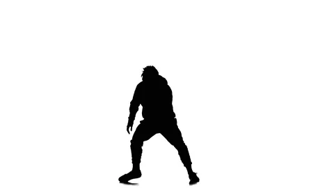 Silhouette of guy dancer dancing hip hop, freestyle, street dance, slow motion Stock Footage 130335065