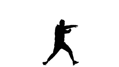 Silhouette of guy dancer dancing hip hop, freestyle, street dance, slow motion Stock Footage 130335257