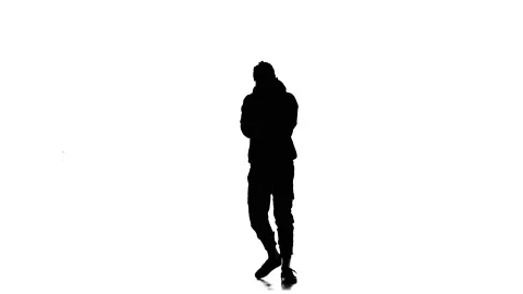 Silhouette of guy dancer dancing hip hop, freestyle, street dance, slow motion Stock Footage 130335417