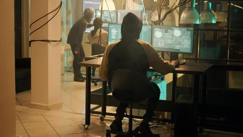 Silhouette of hacker coding encryption to plant trojan virus 写真素材