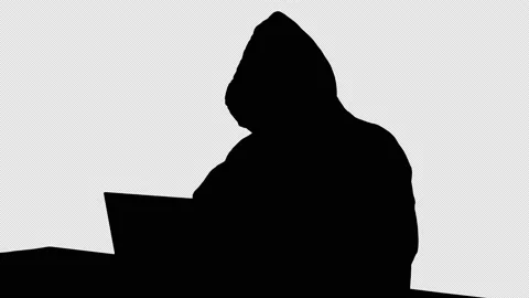 Silhouette Hacker with Vendetta mask on working on a laptop., Alpha Channel Stock Footage 158020760