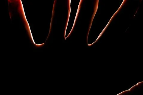 Silhouette of a hand, backlight Stock Photos