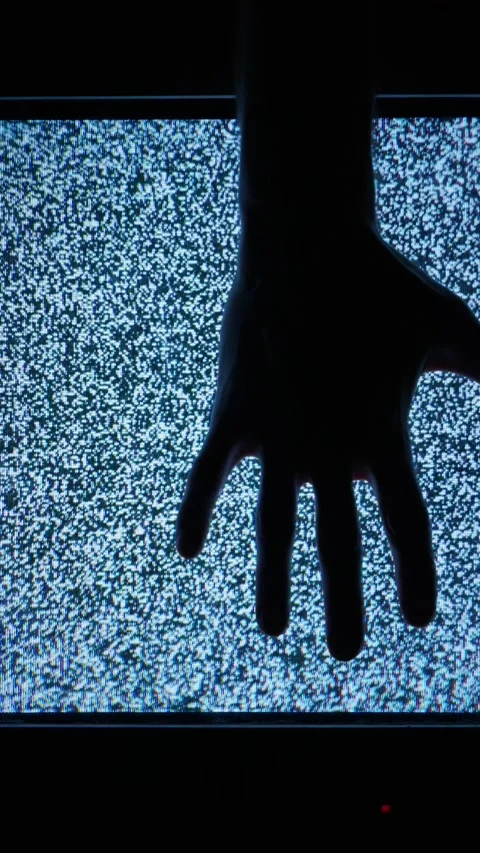 Silhouette Hand Reaching Towards Blue Television Static Screen Display Stock Footage 335635787