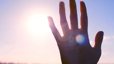 Silhouette of a hand in the sun Video stock 97113576