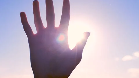 Silhouette of a hand in the sun Stock Footage 97114012