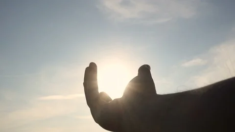 Silhouette hand in sunset sky Stock Footage 104432001
