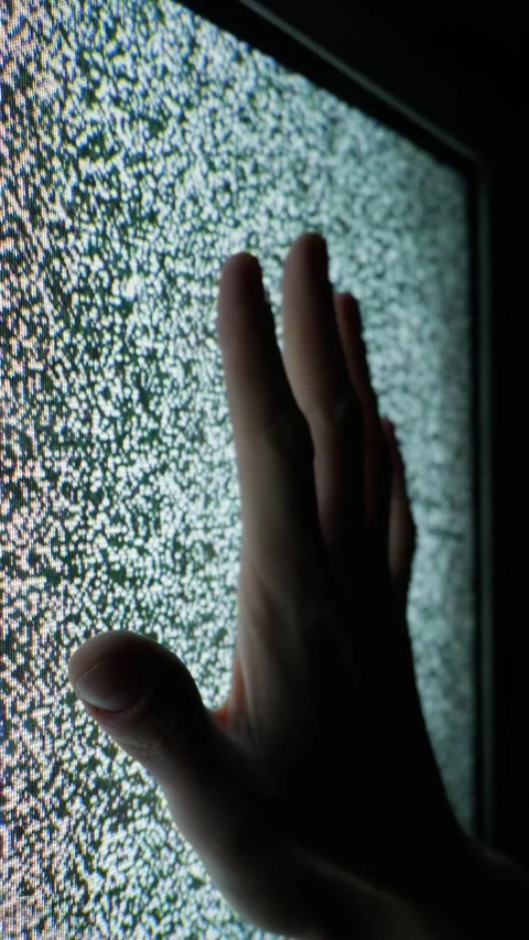 Silhouette of Hand Touching Retro Analog Tv Screen with Static Noise Stock Footage 335635481