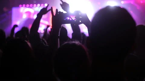 Silhouette hands of audience crowd people use smart phones enjoying the concert. Stock Footage