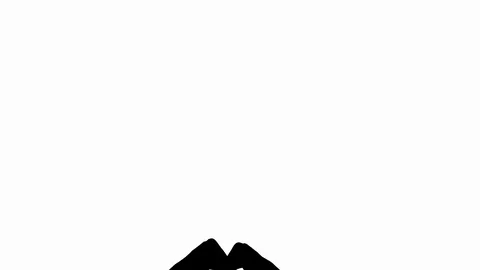 Silhouette of hands in the shape of heart 스톡 동영상 126763484