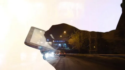 Silhouette of hands that work with the tablet on a background of night traffic Stock Footage 72034899