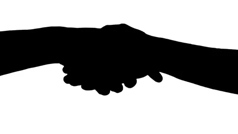 Silhouette handshake on white background. Stock Footage 337354177