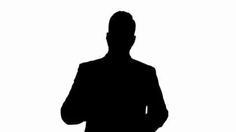 Silhouette Handsome businessman presenting to camera giving three points. Stock Footage 106089161