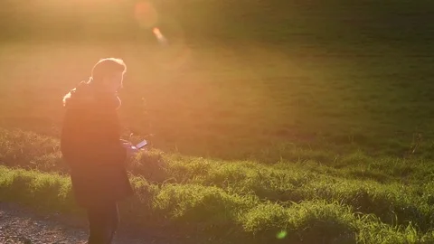Silhouette of Happy man use drones outdoor with sunset, selective focus video Stock Footage 84006491