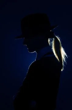 Silhouette in hat Stock Photos
