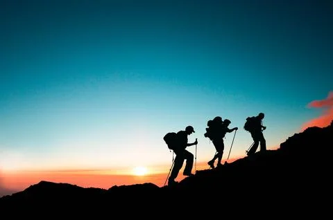 Silhouette hikers walking at sunset as background Stock Illustration