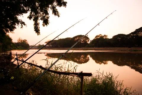 Silhouette hook on river Stock Photos