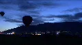 Silhouette Hot Air Balloon Against Mountains HD Footage