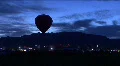 Silhouette Hot Air Balloon Against Mountains HD Footage