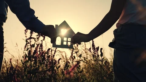 Silhouette of the house in the hands on  Stock Footage 245663775