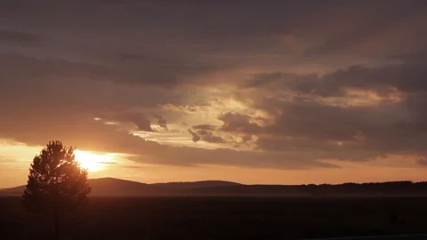 Silhouette image of sunset. sunset over the tree. sun, clouds and mountains.The 動画素材 97154417