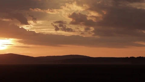 Silhouette image of sunset. sunset over the tree. sun, clouds and mountains.The Stock Footage 97154431