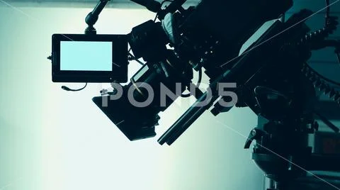 Silhouette images of video camera in tv commercial studio production Stock-Fotos