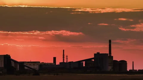 Silhouette of a iron ore processing plant, Opencast mining of iron ore in the Stock Footage 94454214