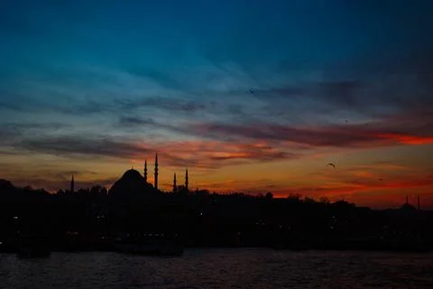 Silhouette of Istanbul with dramatic clouds at sunset. Suleymaniye Mosque Stock Photos