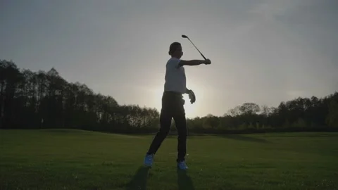 Silhouette Junior Golfing Into Sunset. Video stock 95123317