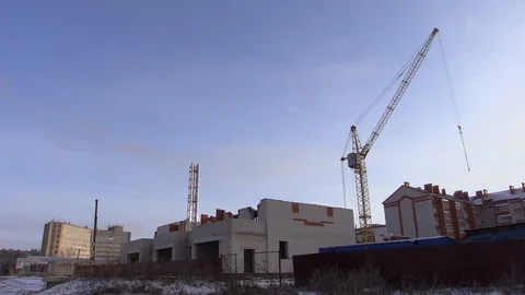 Silhouette large construction crane at background blue sky in winter Stock Footage 85785505