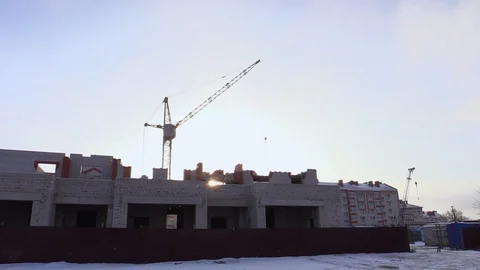 Silhouette large construction crane at background blue sky Video stock 85785563