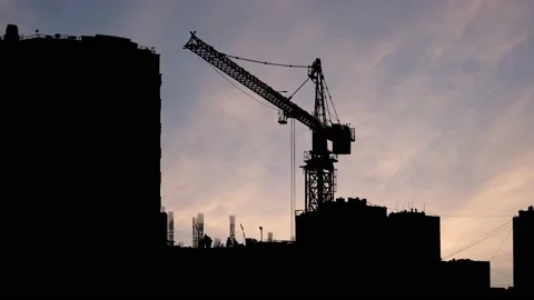 Silhouette of a Large Tower Crane on a Construction Site Stock Footage 238856434
