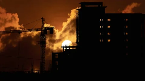 Silhouette of a Large Tower Crane at a Construction Site Vídeo Stock 239907428