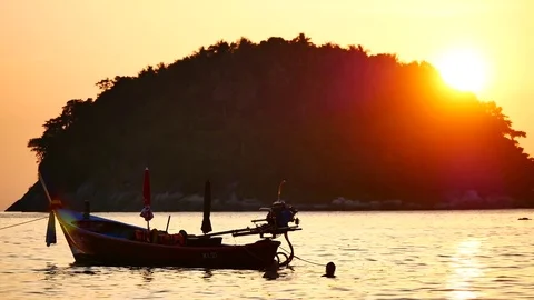 Silhouette long tail boat converted to boat excursions and  tourist floating  Stock Footage 83473596