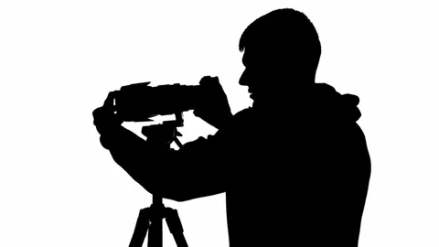 Silhouette of a male videographer with a... | Stock Video | Pond5