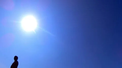 Silhouette of a man against a blue sky. sun. Stock-Footage 341839963
