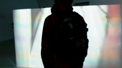 Silhouette of a man on the background of the projection Stock Footage 104260255