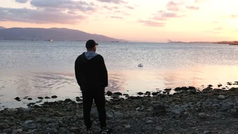 Silhouette of man on beach Stock Footage 219755223
