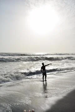 Silhouette of a man at beach Stock Photos
